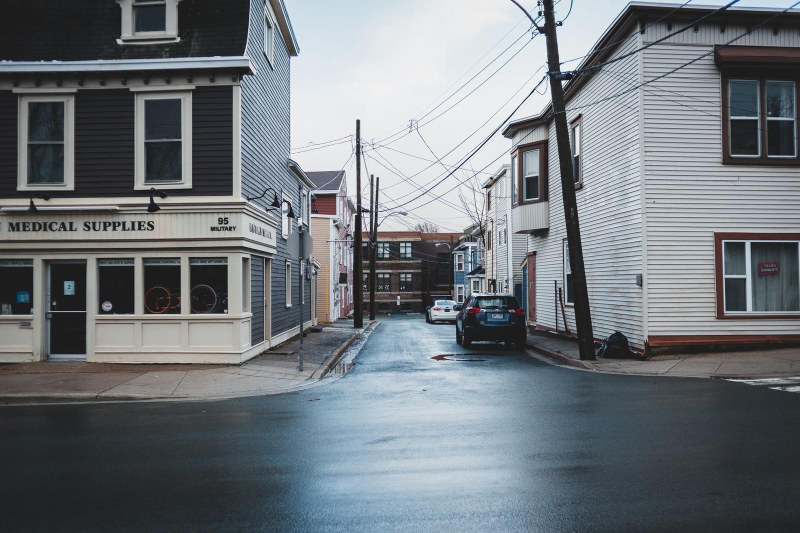Residential Buildings near Wet Asphalt Road